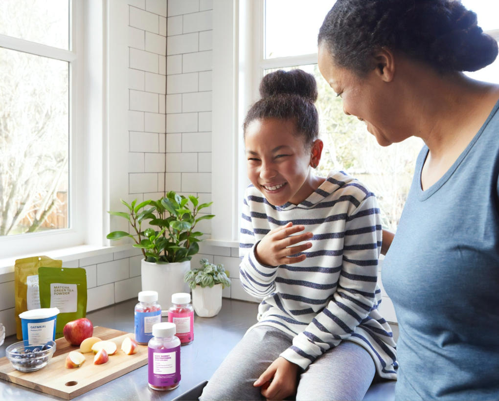 Image of mother with daughter laughing together