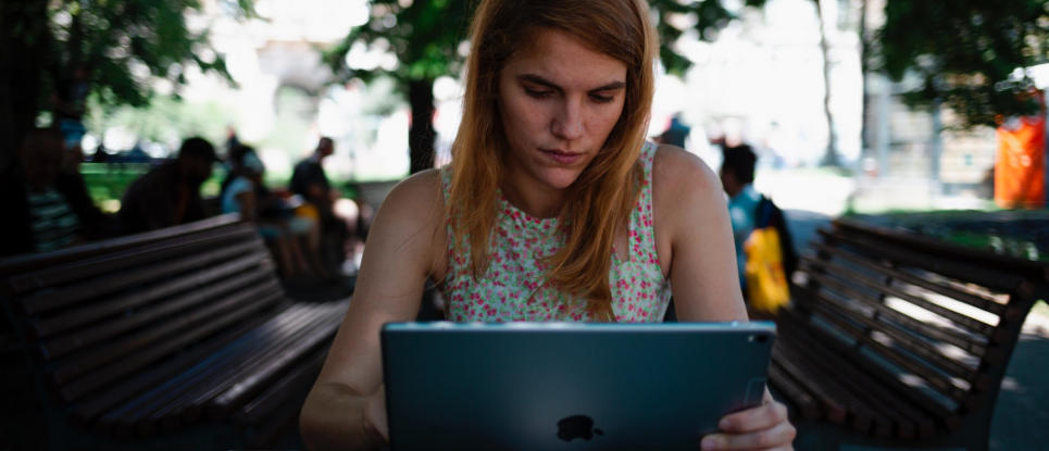 Image of woman reading something on her laptop